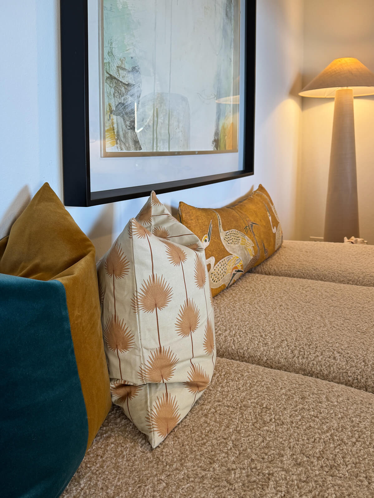 The Parlor sitting room — comfortable seating, small desk, layered textures and warm tones